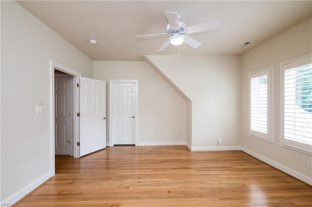 5225 Regatta Pointe Rd, Suffolk, VA 23435 - additional living space featuring light wood finished floors, ceiling fan, and baseboards