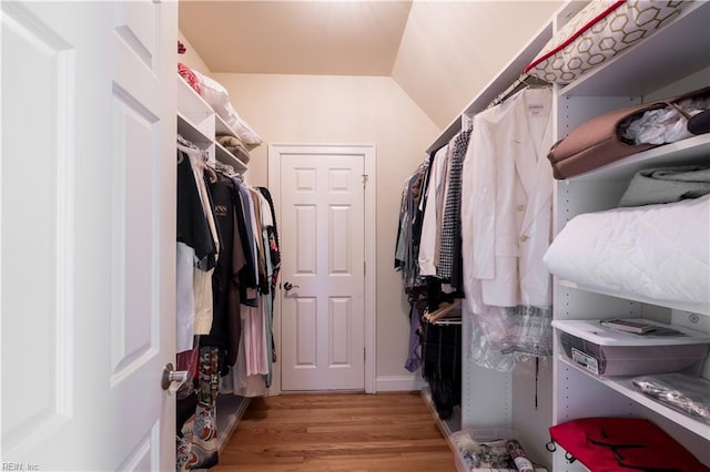 5225 Regatta Pointe Rd, Suffolk, VA 23435 - walk in closet featuring light wood-style flooring and vaulted ceiling