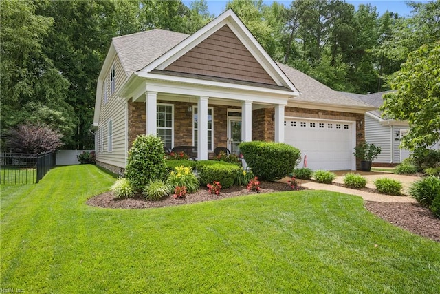 2972 Elegance Ln, Virginia Beach, VA 23456 - view of front of property with an attached garage, stone siding, a shingled roof, a porch, and driveway