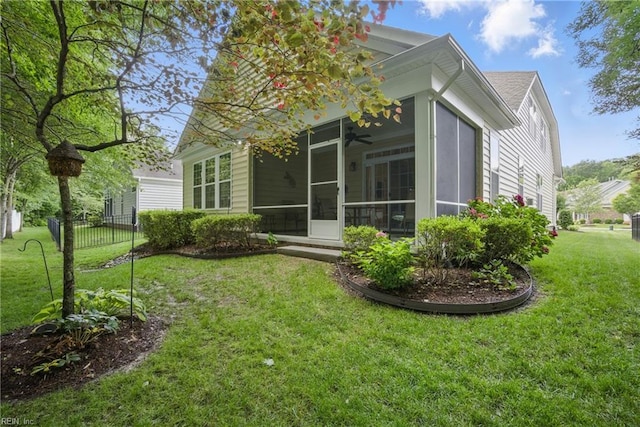 2972 Elegance Ln, Virginia Beach, VA 23456 - back of property featuring a sunroom, a lawn, and a ceiling fan