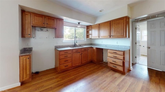 400 Ticonderoga Rd, Virginia Beach, VA 23462 - kitchen featuring light wood-type flooring, brown cabinets, open shelves, and light stone countertops