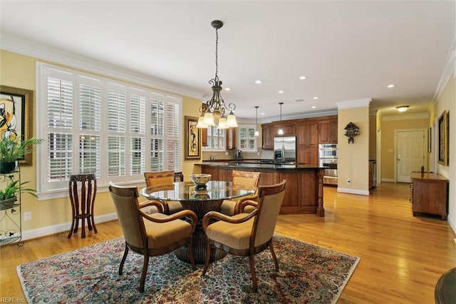 209 St Cuthbert, Williamsburg, VA 23188 - dining area featuring crown molding, light wood finished floors, baseboards, recessed lighting, and a chandelier