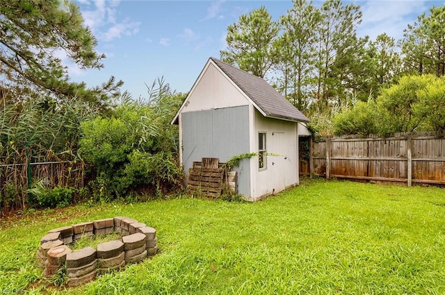 160 Ridge Rd, Poquoson, VA 23662 - view of shed with an outdoor fire pit and a fenced backyard