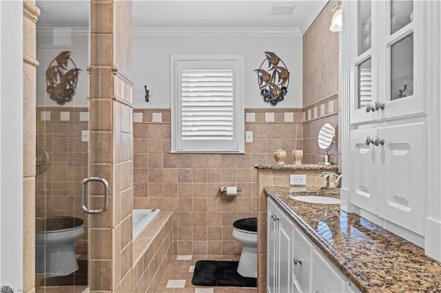 1604 Tether Keep, Virginia Beach, VA 23454 - bathroom with tile walls, vanity, a garden tub, a shower stall, and crown molding
