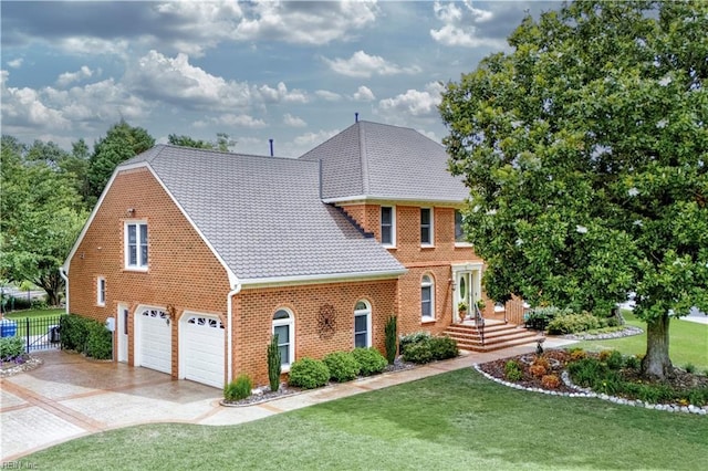 1604 Tether Keep, Virginia Beach, VA 23454 - view of front of property featuring a garage, brick siding, and concrete driveway
