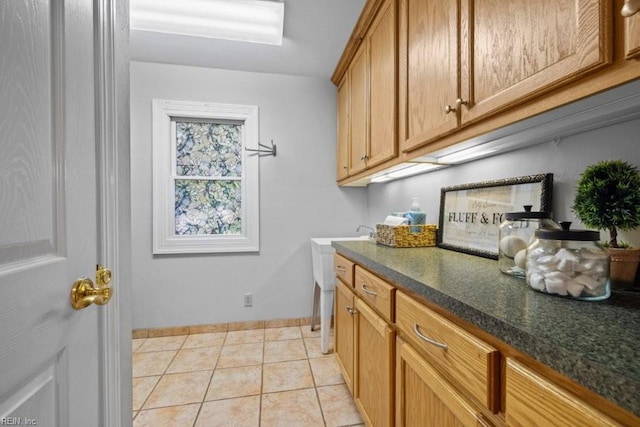 1405 Gravatt Ln, Virginia Beach, VA 23454 - laundry area featuring cabinet space and light tile patterned floors