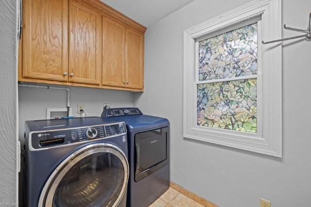 1405 Gravatt Ln, Virginia Beach, VA 23454 - laundry room with cabinet space, washing machine and dryer, and light tile patterned floors