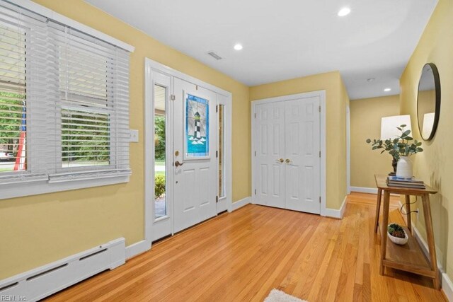 1405 Gravatt Ln, Virginia Beach, VA 23454 - foyer entrance featuring a baseboard heating unit, light wood-style flooring, and recessed lighting