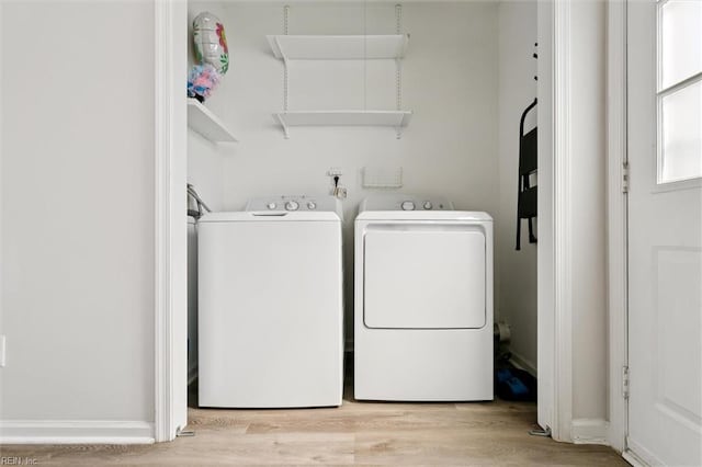 385 Susan Constant Dr, Newport News, VA 23608 - washroom with washing machine and clothes dryer and wood finished floors