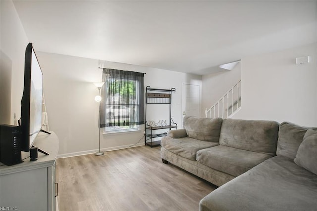 385 Susan Constant Dr, Newport News, VA 23608 - living area featuring stairs and light wood finished floors