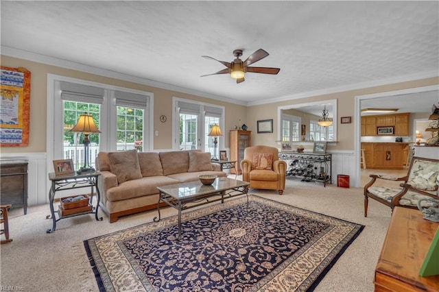 1832 Tree Line Rd, Virginia Beach, VA 23454 - living room with light carpet, wainscoting, a ceiling fan, crown molding, and a decorative wall