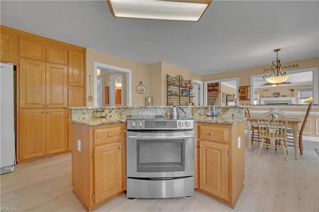 1832 Tree Line Rd, Virginia Beach, VA 23454 - kitchen featuring electric range, freestanding refrigerator, light wood-style floors, a center island, and light stone counters