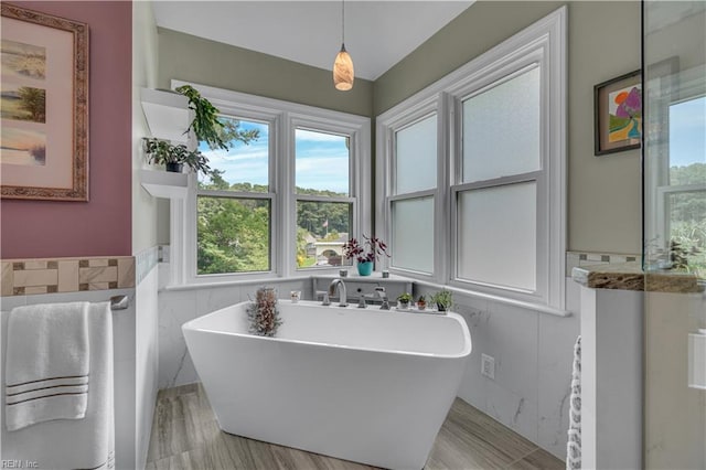 1832 Tree Line Rd, Virginia Beach, VA 23454 - full bathroom with tile walls, a freestanding tub, plenty of natural light, and a wainscoted wall