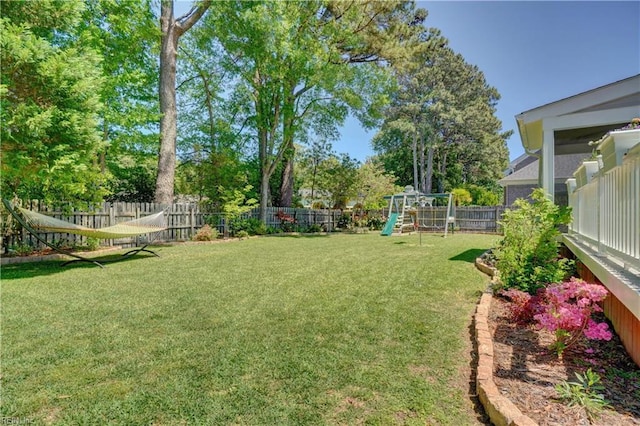 1832 Tree Line Rd, Virginia Beach, VA 23454 - fenced backyard with a playground and view of wooded area