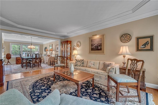 1832 Tree Line Rd, Virginia Beach, VA 23454 - living area with wood finished floors, ornamental molding, and a chandelier