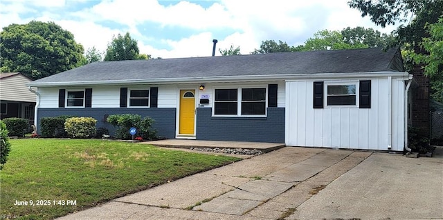 740 Olivieri Ln, Virginia Beach, VA 23455 - ranch-style house with board and batten siding, a front lawn, and brick siding