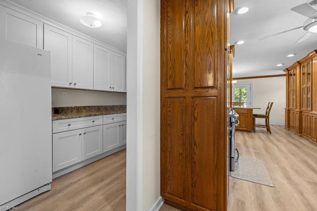 1309 Taft Rd, Chesapeake, VA 23322 - kitchen featuring freestanding refrigerator, light wood-style floors, ceiling fan, glass insert cabinets, and dark countertops