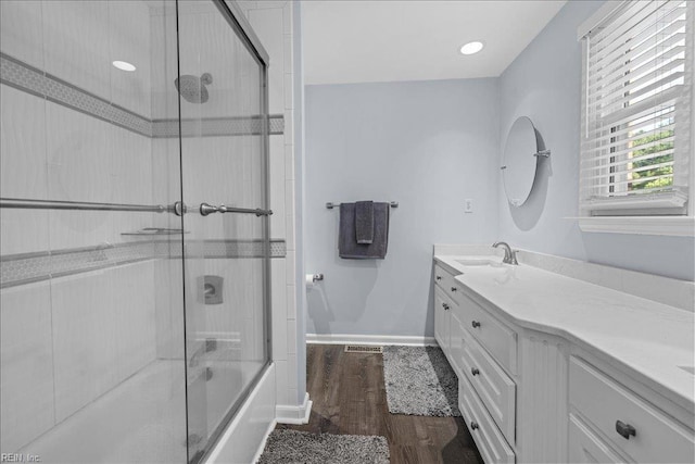 1309 Taft Rd, Chesapeake, VA 23322 - bathroom with vanity, wood finished floors, and enclosed tub / shower combo
