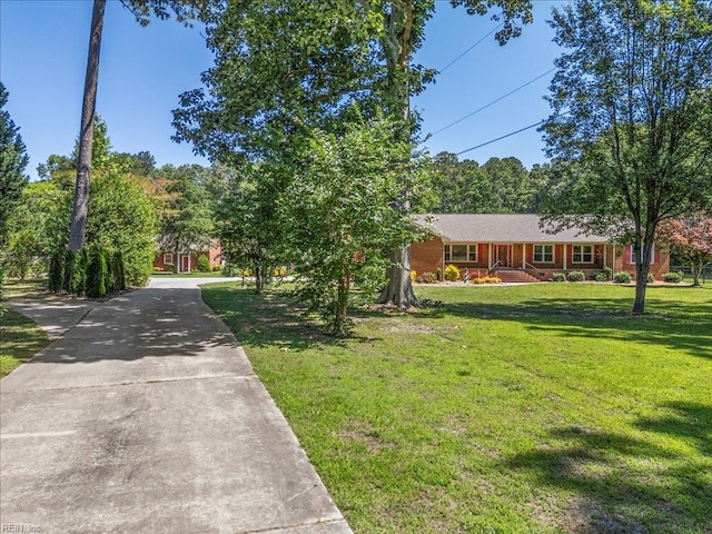 1309 Taft Rd, Chesapeake, VA 23322 - view of front facade with a front yard and concrete driveway