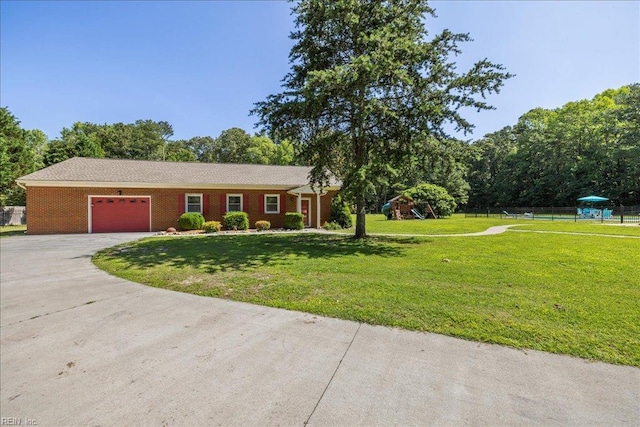 1309 Taft Rd, Chesapeake, VA 23322 - single story home with a playground, a garage, driveway, and brick siding