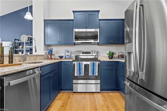 1004 Kathy Ann Way, Carrollton, VA 23314 - kitchen with stainless steel appliances, blue cabinetry, light stone countertops, and light wood-style floors