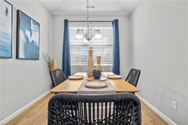1004 Kathy Ann Way, Carrollton, VA 23314 - dining room with a chandelier and light wood-type flooring