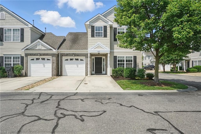 5217 Maracas Arch Arch Unit 50, Virginia Beach, VA 23462 - multi unit property with concrete driveway, an attached garage, and brick siding