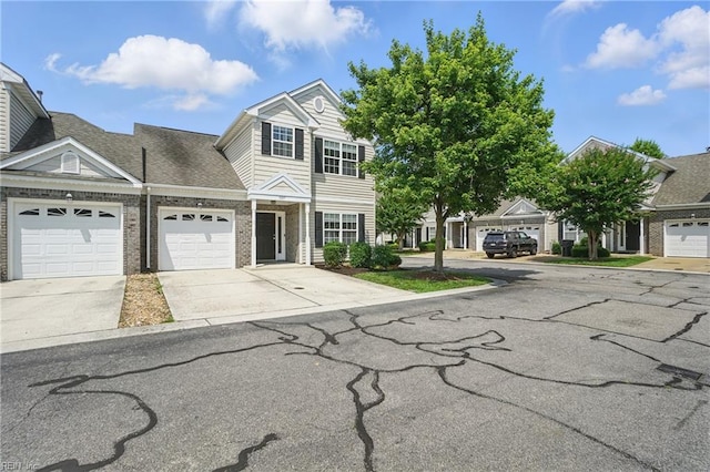5217 Maracas Arch Arch Unit 50, Virginia Beach, VA 23462 - view of front of property with driveway, a garage, and brick siding