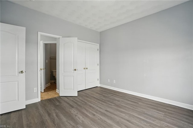 5217 Maracas Arch Arch Unit 50, Virginia Beach, VA 23462 - unfurnished bedroom featuring wood finished floors, a closet, and ensuite bath