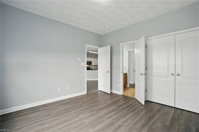 5217 Maracas Arch Arch Unit 50, Virginia Beach, VA 23462 - unfurnished bedroom with wood finished floors and a closet