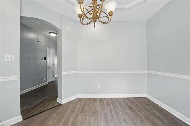 5217 Maracas Arch Arch Unit 50, Virginia Beach, VA 23462 - unfurnished dining area with arched walkways, wood finished floors, and a chandelier