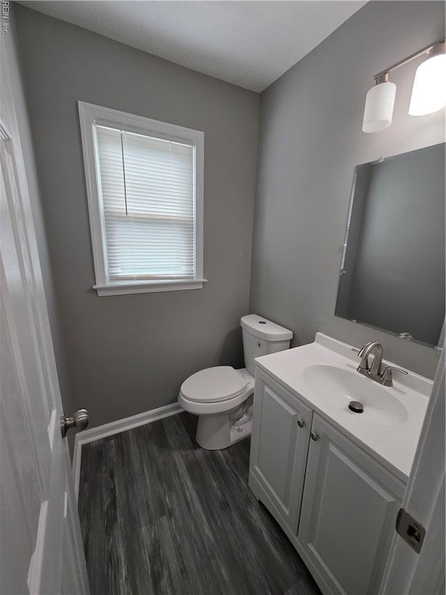 11 Lake Walk Xing, Hampton, VA 23666 - half bathroom with toilet, vanity, wood finished floors, and baseboards
