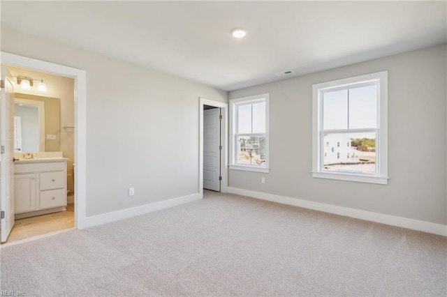 108 Robert Bruce Rd, Poquoson, VA 23662 - unfurnished bedroom with light carpet and connected bathroom