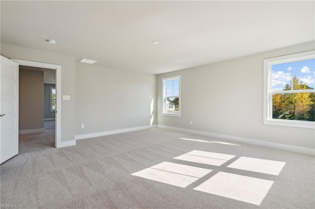 108 Robert Bruce Rd, Poquoson, VA 23662 - empty room featuring healthy amount of natural light, light carpet, and a smoke detector