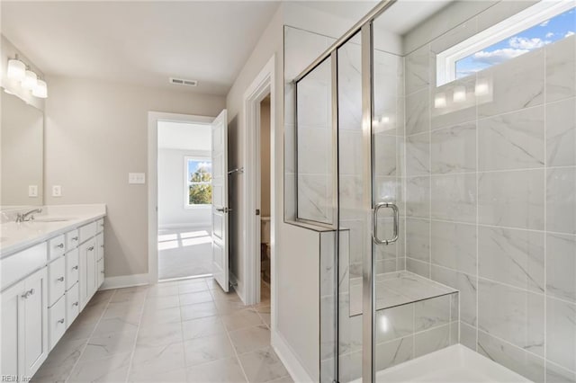 108 Robert Bruce Rd, Poquoson, VA 23662 - full bathroom featuring plenty of natural light, vanity, a stall shower, and marble look tiles