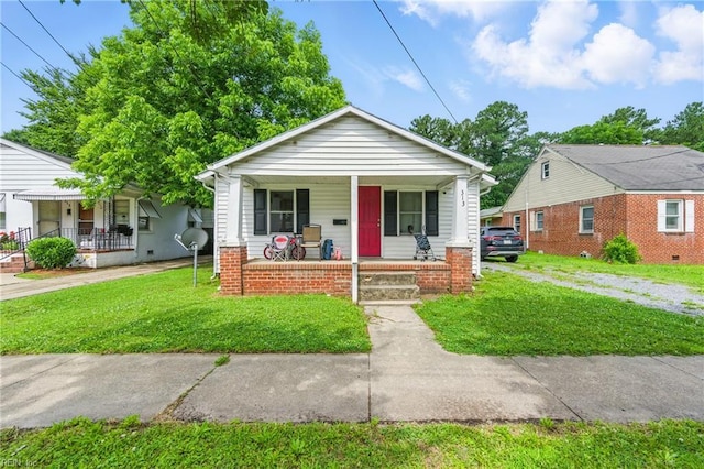 313 Saint James Ave, Suffolk, VA 23434 - bungalow with a porch and a front yard