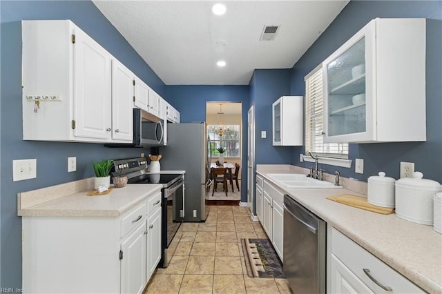 4 Angelia Way, Hampton, VA 23663 - kitchen with appliances with stainless steel finishes, white cabinets, light countertops, glass insert cabinets, and recessed lighting