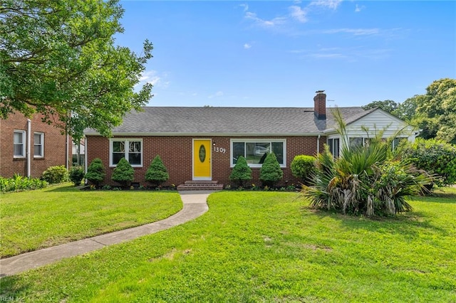 1309 Wickham Ave, Newport News, VA 23607 - single story home with a front yard, brick siding, and a chimney