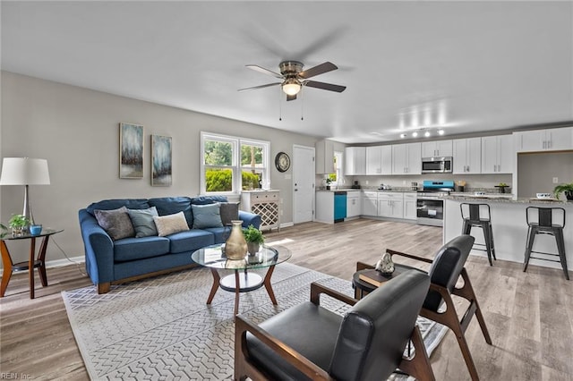 1309 Wickham Ave, Newport News, VA 23607 - living room with ceiling fan and light wood-style floors
