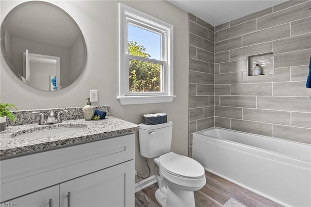 1309 Wickham Ave, Newport News, VA 23607 - full bathroom featuring vanity, wood finished floors, and tub / shower combination