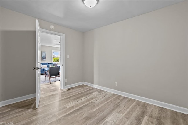 1309 Wickham Ave, Newport News, VA 23607 - empty room with light wood finished floors and a smoke detector