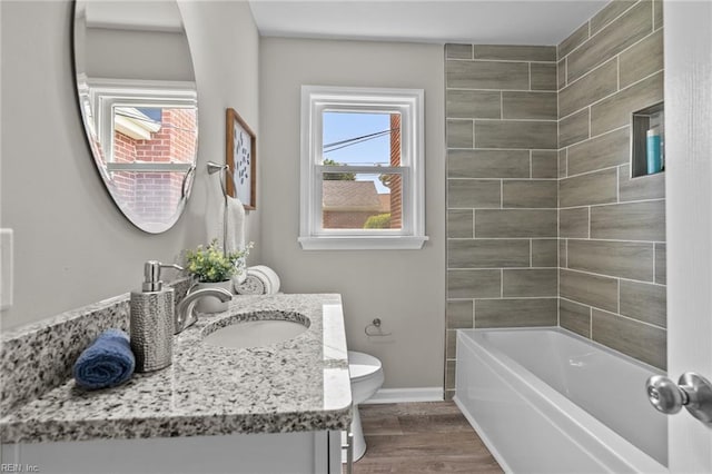 1309 Wickham Ave, Newport News, VA 23607 - full bathroom with vanity, wood finished floors, and bathing tub / shower combination