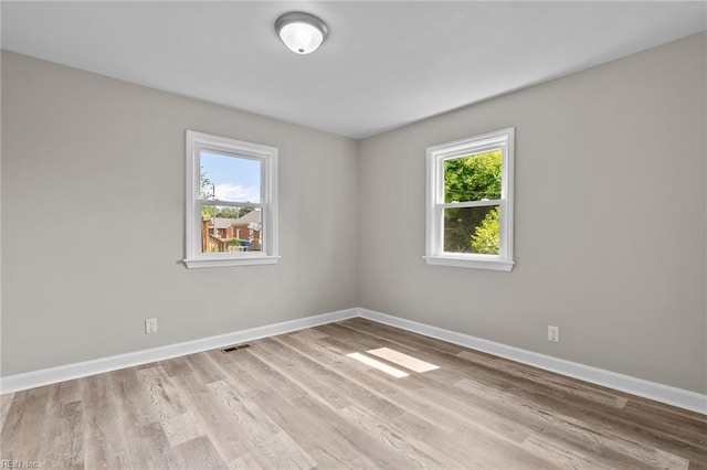 1309 Wickham Ave, Newport News, VA 23607 - spare room with plenty of natural light and wood finished floors