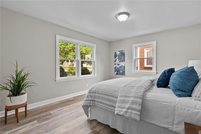 1309 Wickham Ave, Newport News, VA 23607 - bedroom featuring multiple windows and wood finished floors