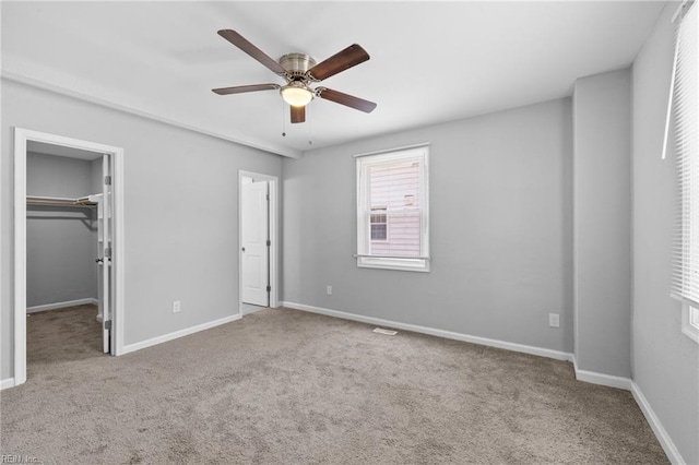 4825 Robin Hood Rd, Norfolk, VA 23513 - unfurnished bedroom featuring carpet flooring, a spacious closet, a closet, and a ceiling fan