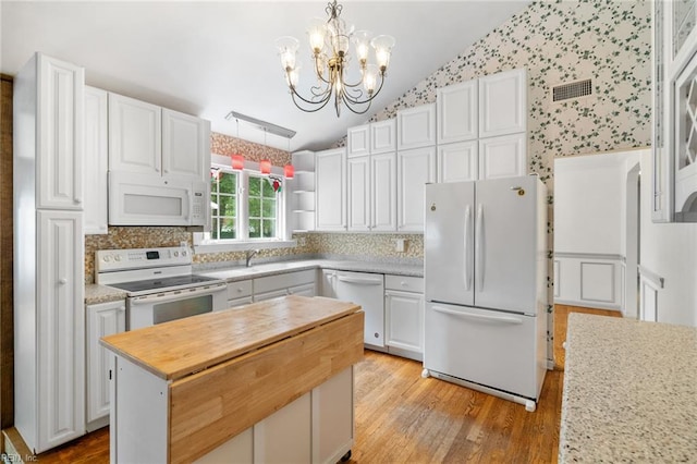 318 Hearthstone Way, Newport News, VA 23608 - kitchen with white appliances, lofted ceiling, butcher block countertops, light wood finished floors, and white cabinets