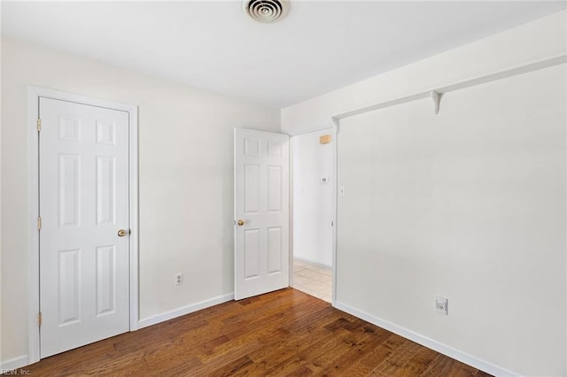 318 Hearthstone Way, Newport News, VA 23608 - unfurnished bedroom featuring wood finished floors and baseboards