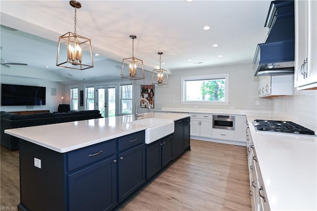 5227 Lake Shores Rd, Virginia Beach, VA 23455 - kitchen featuring recessed lighting, light countertops, stainless steel gas cooktop, light wood-type flooring, and open floor plan