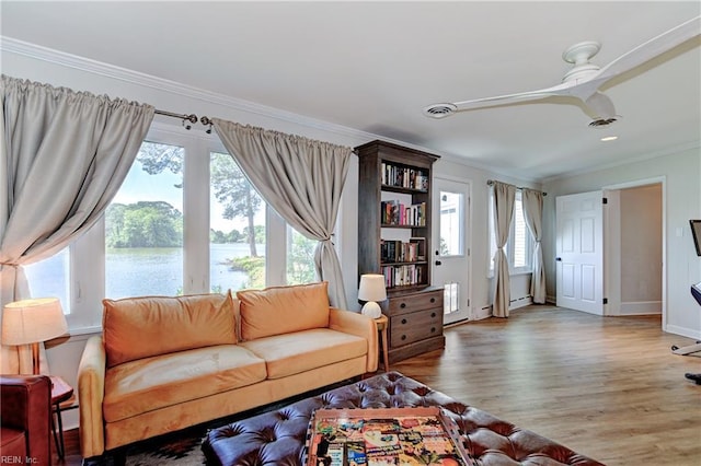 5227 Lake Shores Rd, Virginia Beach, VA 23455 - living room featuring ornamental molding, plenty of natural light, wood finished floors, and a water view