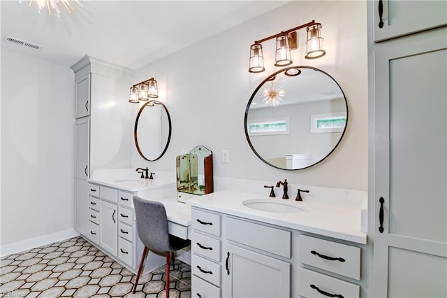 5227 Lake Shores Rd, Virginia Beach, VA 23455 - bathroom featuring two vanities and baseboards